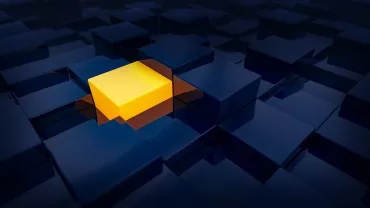 Cubo amarillo rodeado de cubos oscuros.