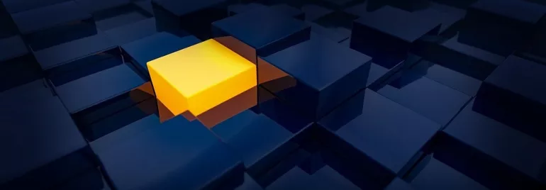 Cubo amarillo rodeado de cubos oscuros.