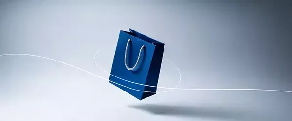 Una bolsa de compras azul que representa servicios de compra y logística.